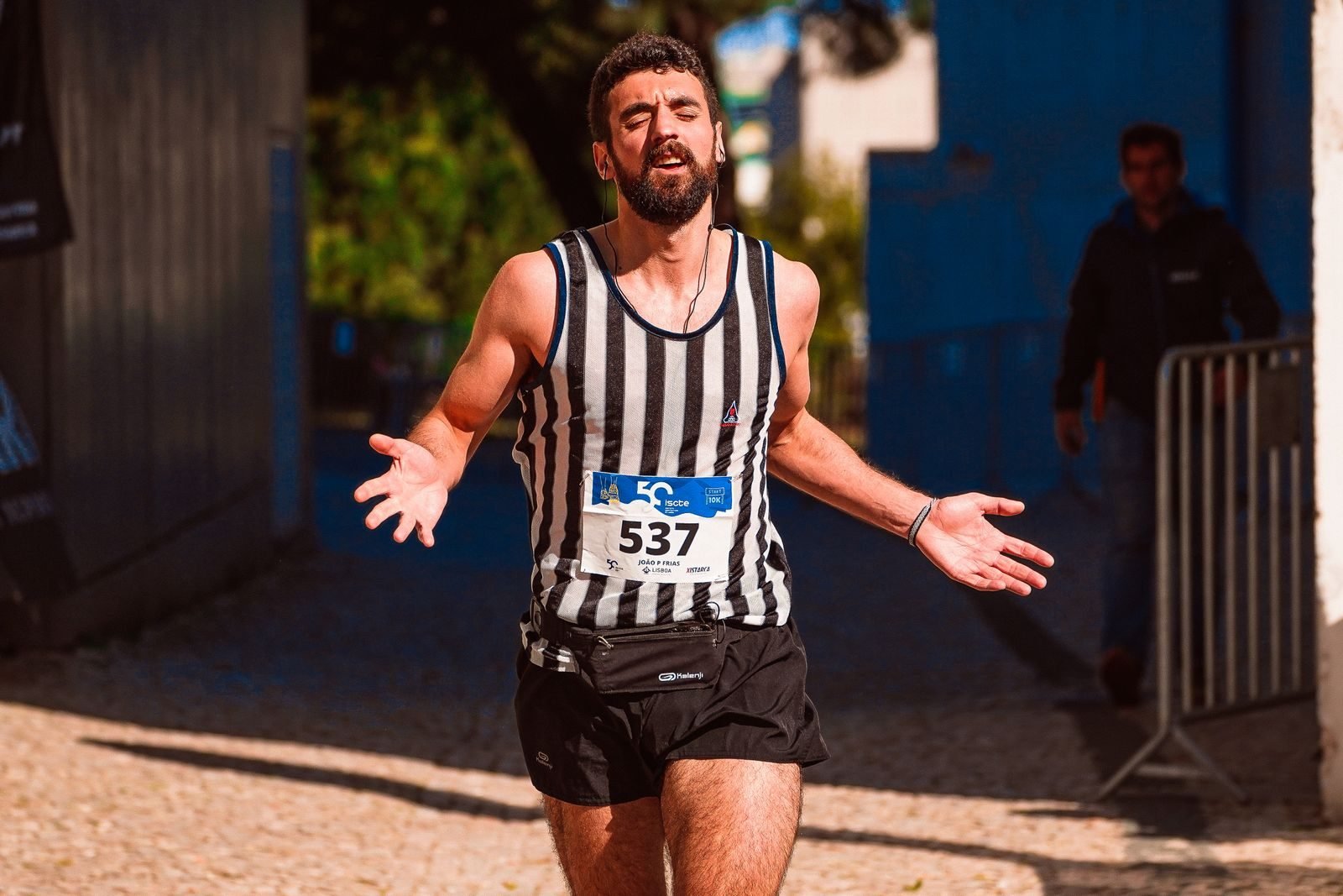 Athlete finishing a race with open arms