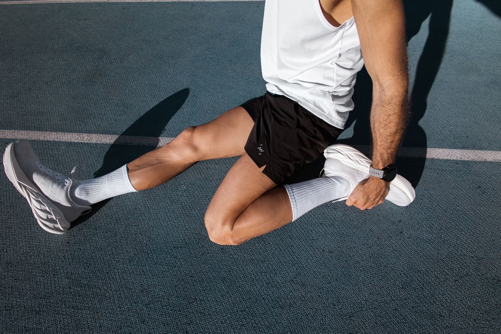 Athlete doing a warm up before running on a track