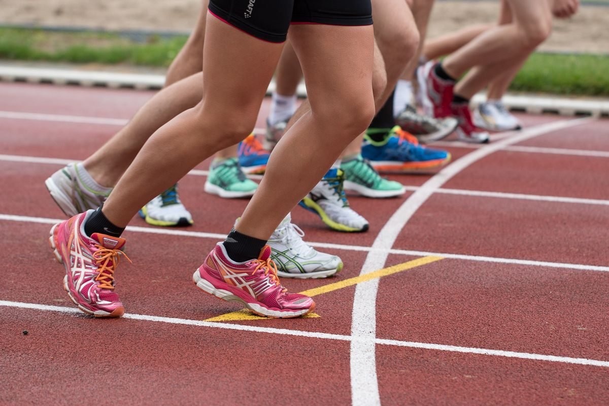Athletes feet at the start line of a track race