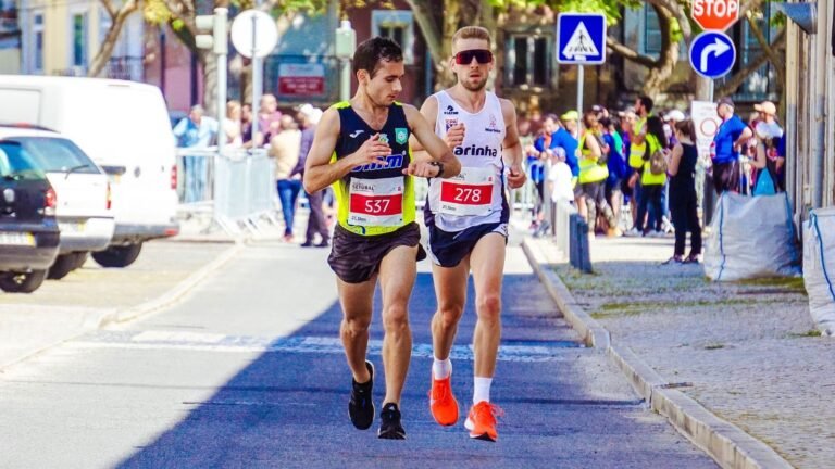 Two runners racing a city marathon