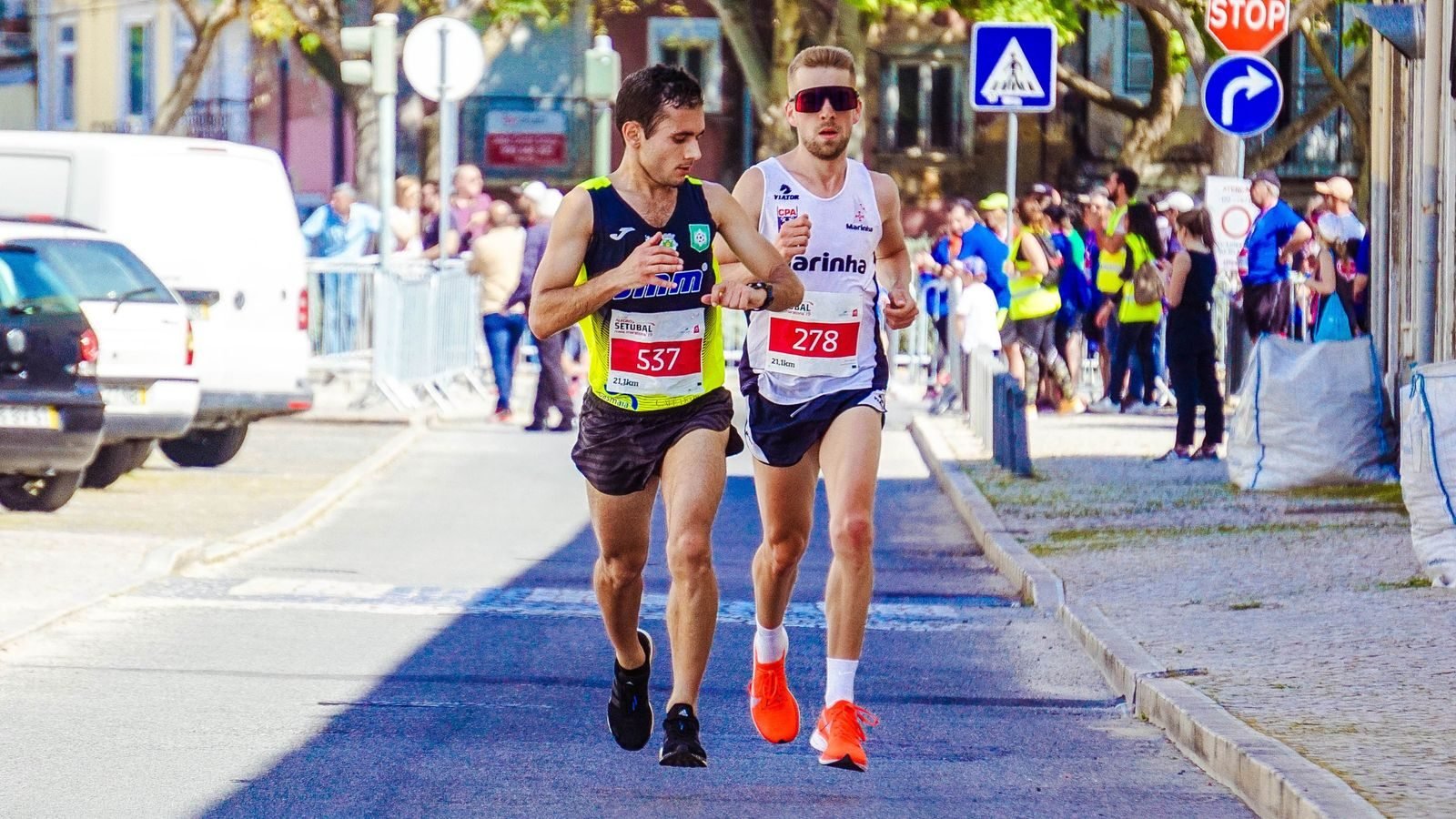 Two runners racing a city marathon