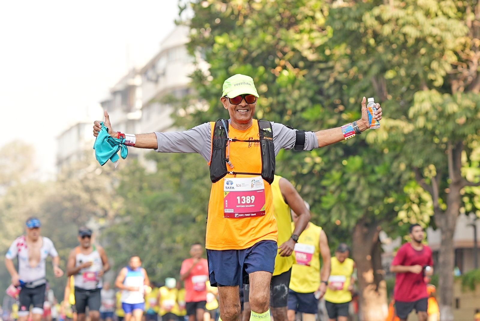 Runner crossing the finish line with arms wide open