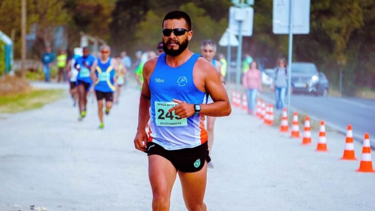 Focused runner struggling in a marathon under the sun, close to hitting the wall