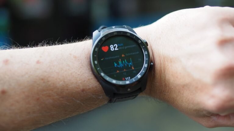 Smartwatch on a wrist showing heart rate