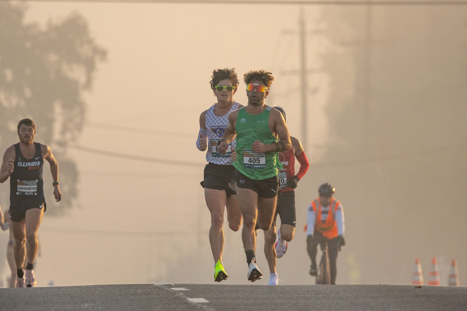Group of marathon runners at dawn controlling their pace to run a negative split