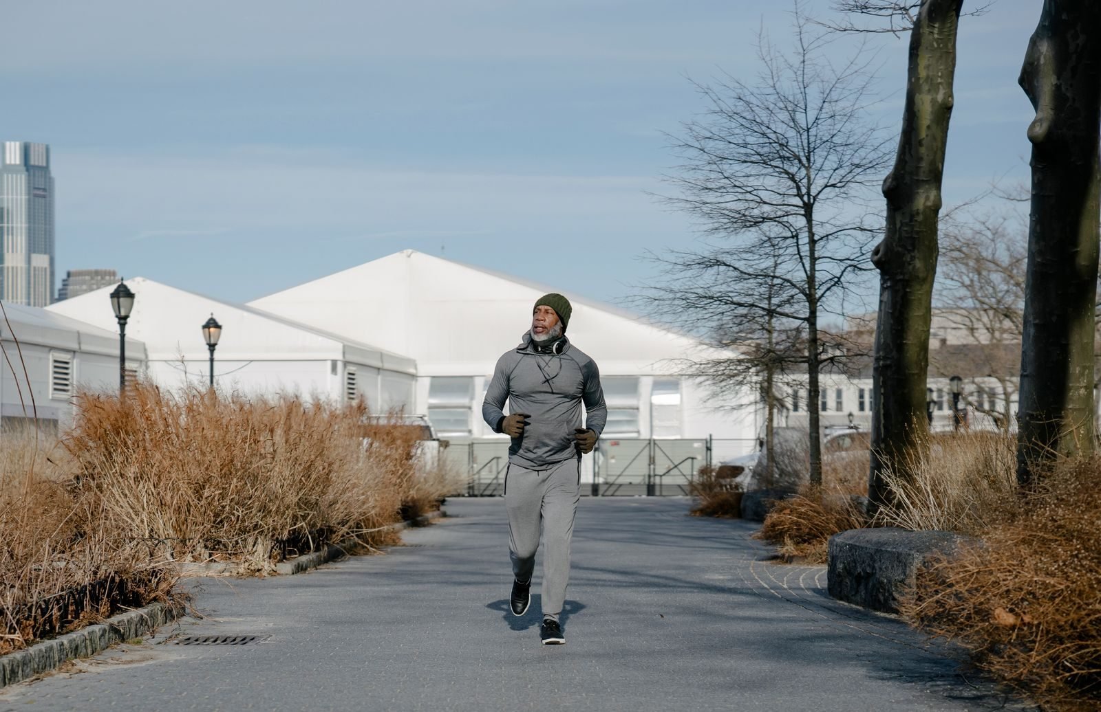 Older man in warm clothes running in winter, gifts for older runners