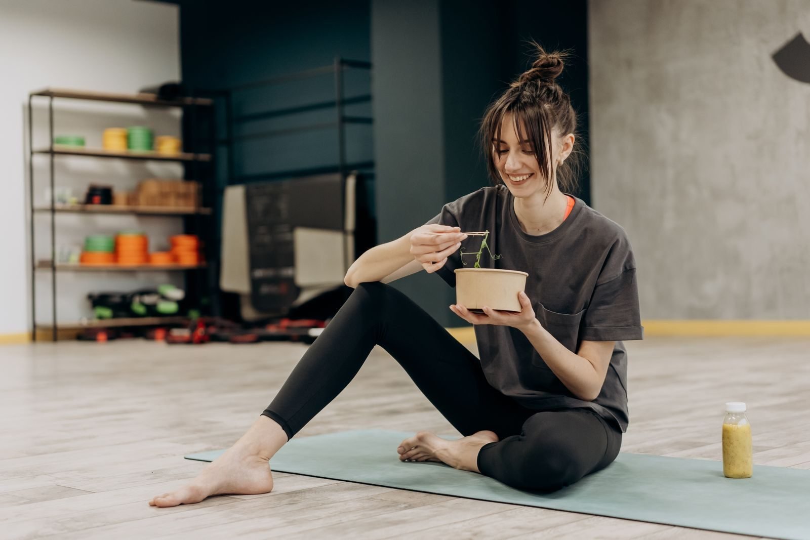 Woman eating a salad after exercising