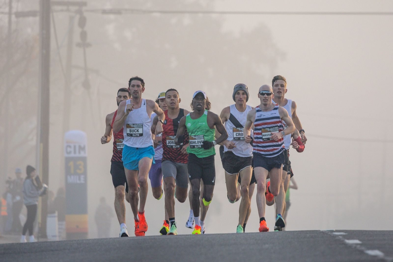 Marathon runners in racing shoes, where the training vs racing shoes choice matters most