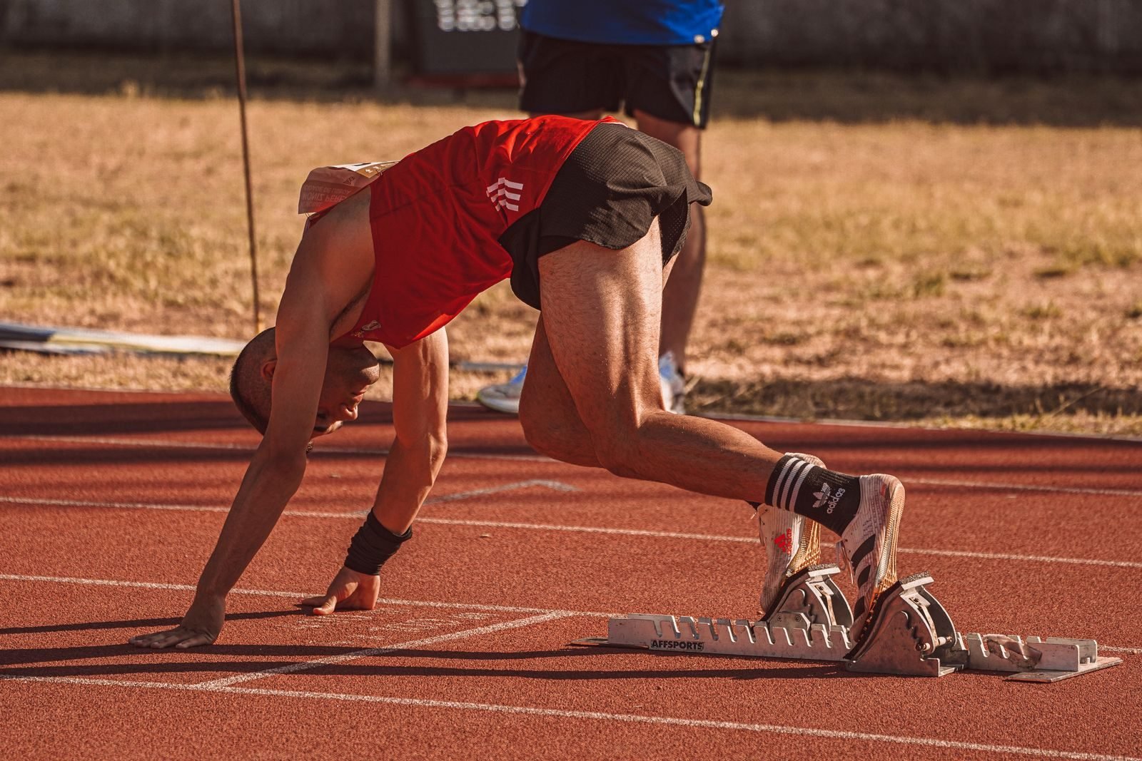 Athlete getting set for a fast repetition on the track