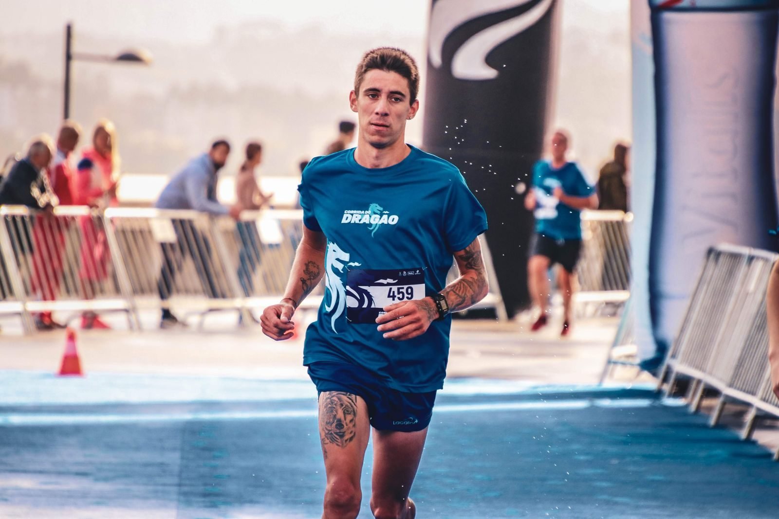 Runner finishing a marathon on a sunny day