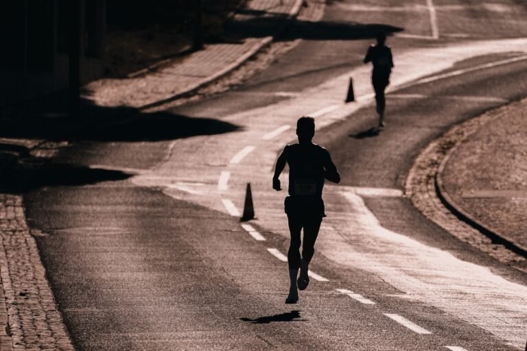 Silhouette of a runner on a road at sunset, illustrative photo for Sant Silvestre de Berga 2026