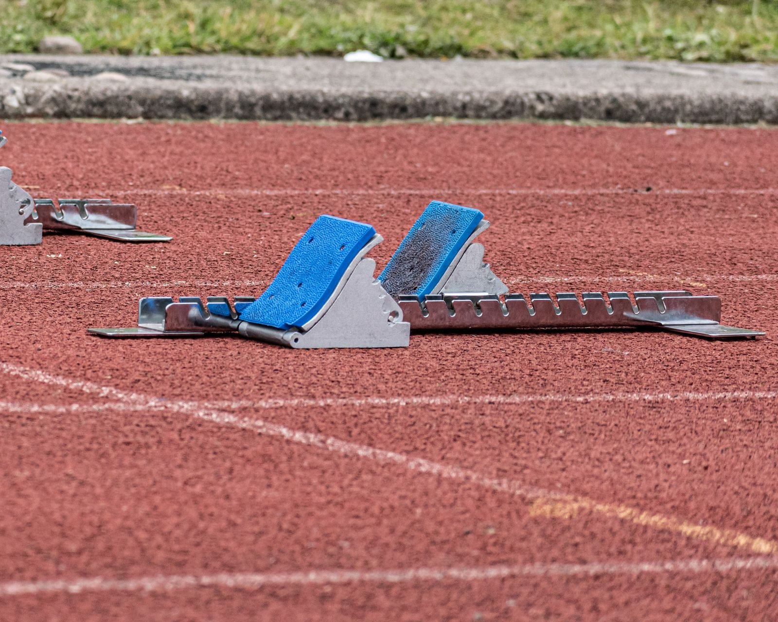 Starting blocks on a red athletics track