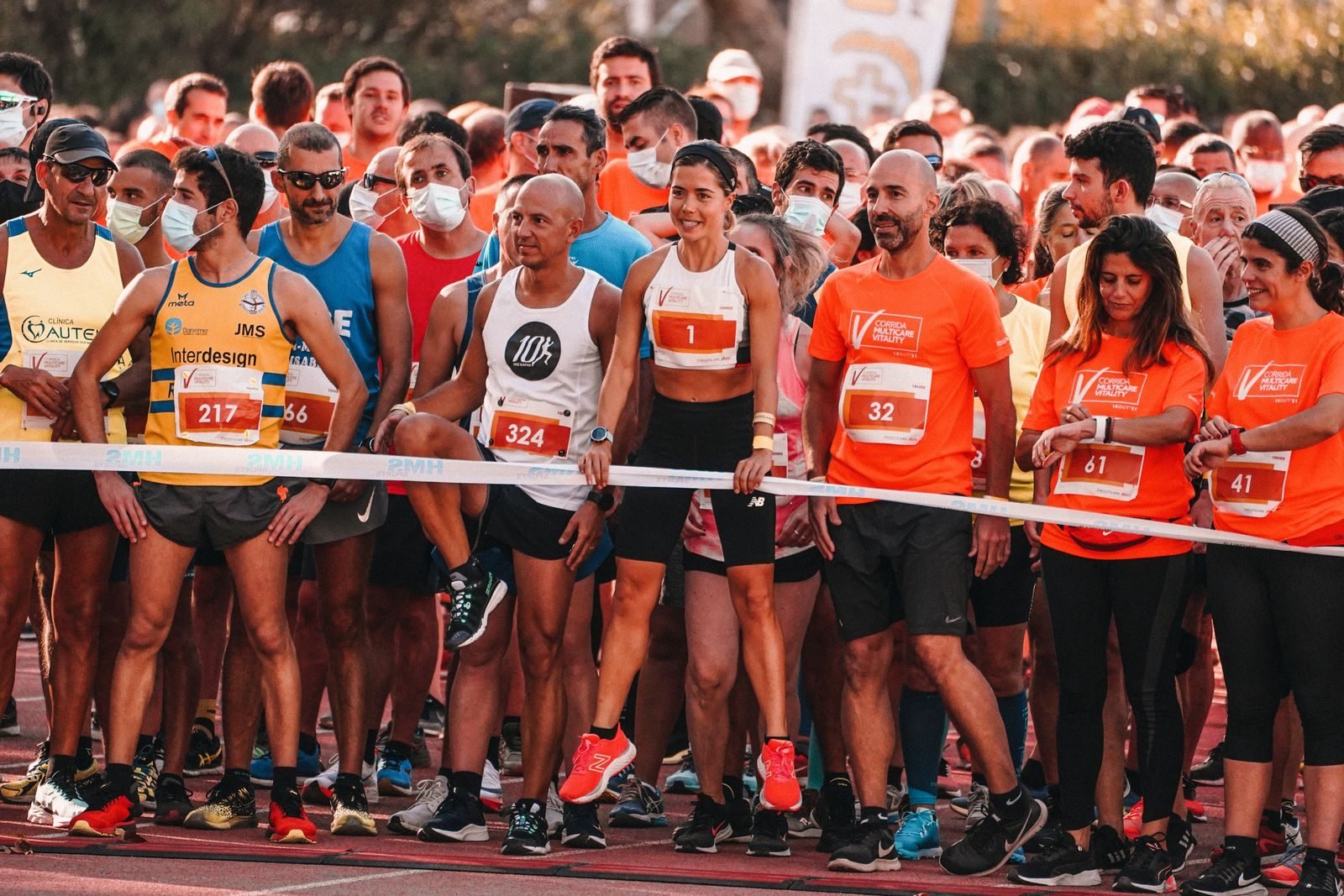 Runners at the start line of a race after tapering