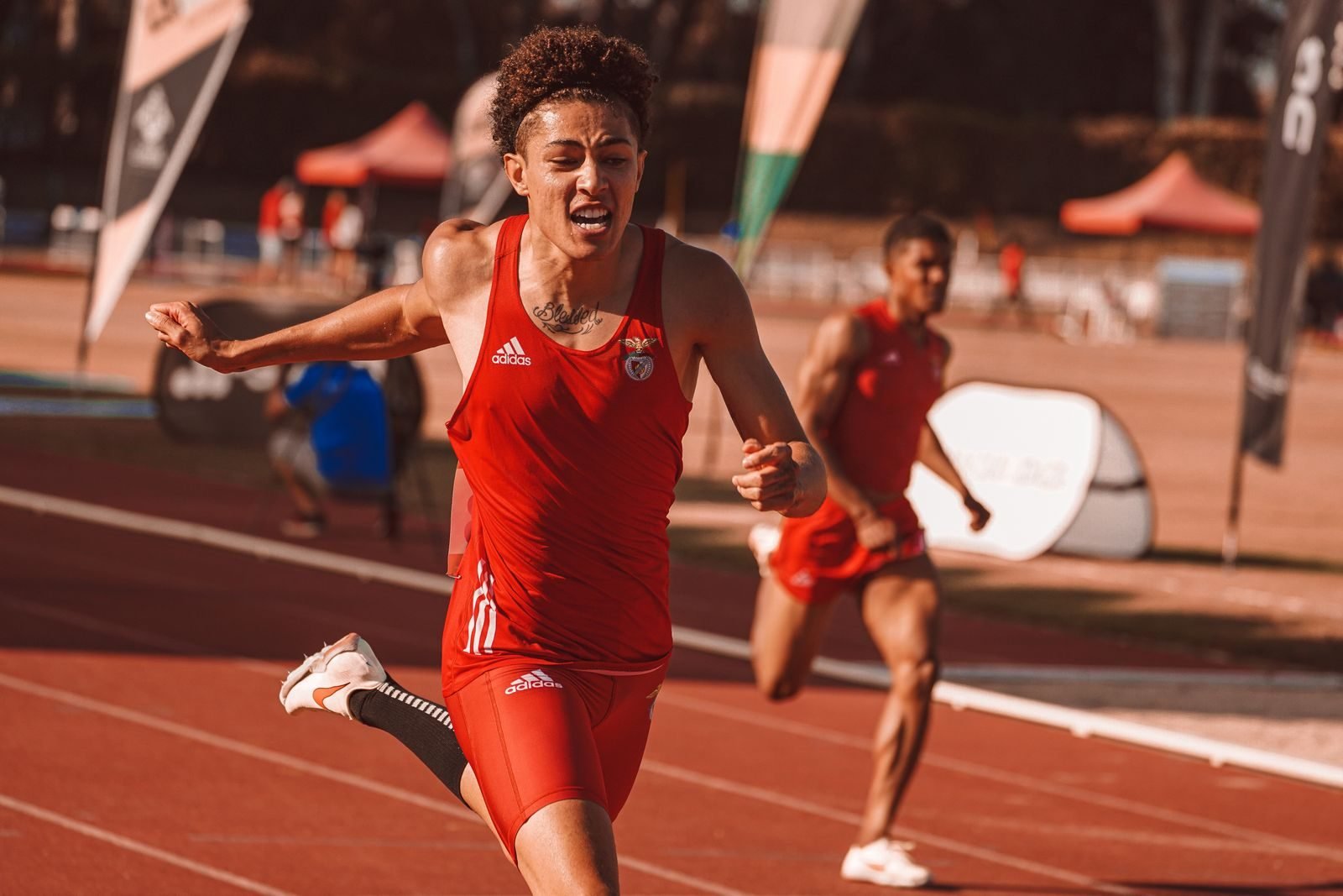 Athlete crossing the finish line in a track race