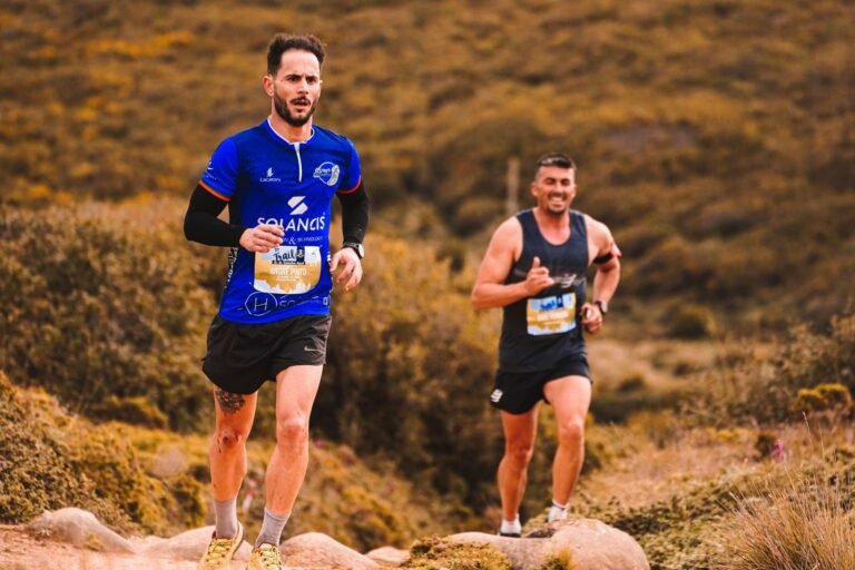 Two trail runners with bibs on a mountain path, illustrative photo for Vilaverd Skyrace 2026
