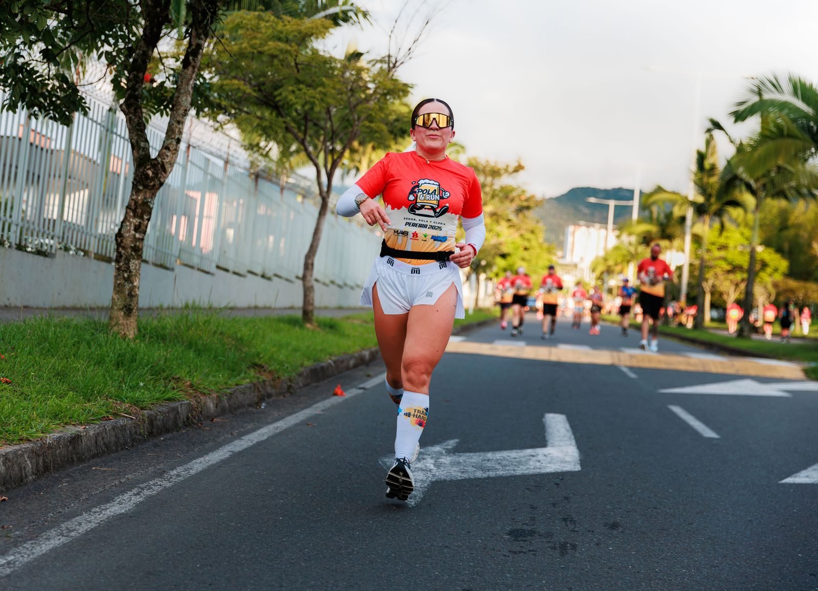 Focused woman running in an outdoor road race
